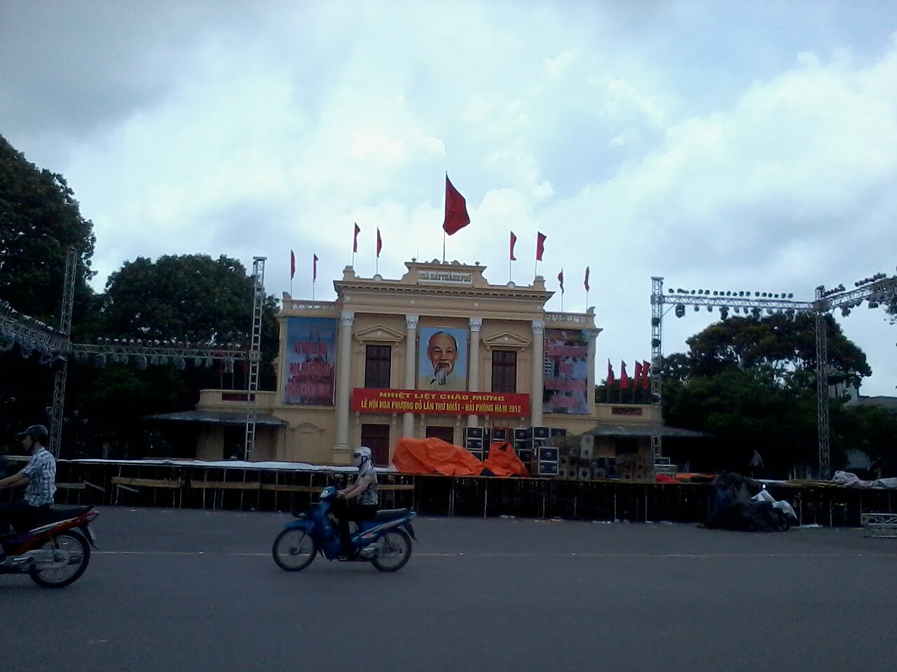 Colonial architecture and manicured flower gardens of Hai Phong Municipal Theater Opera House