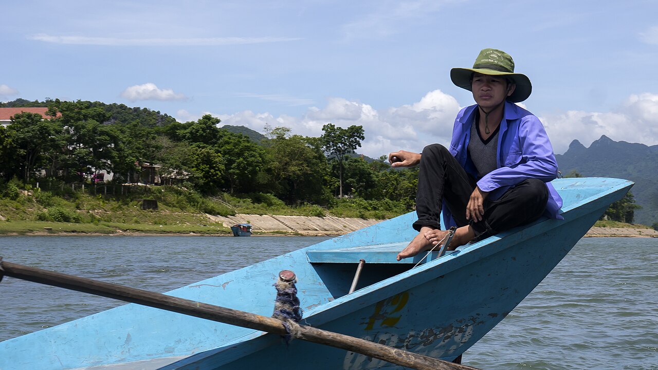 Traditional riverboat operating on the Son River near Phong Nha Cave