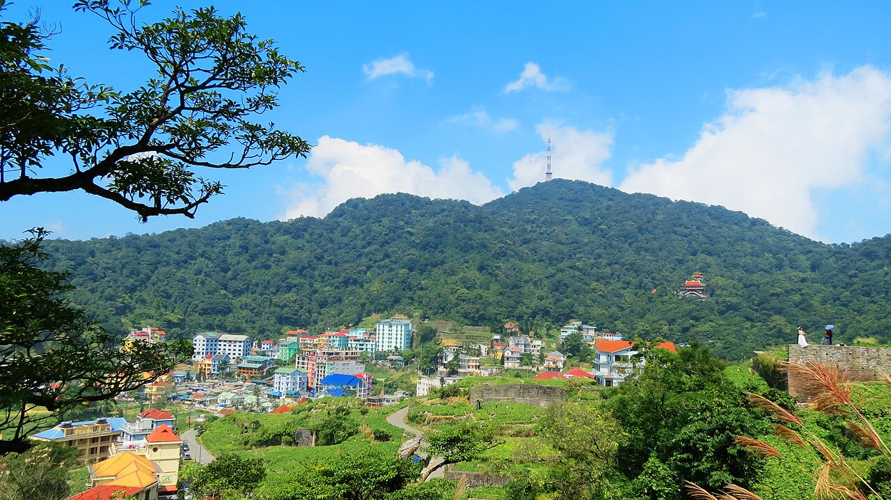 Misty mountain ridges and hill station villas nestled in the high cloud forests of Tam Dao