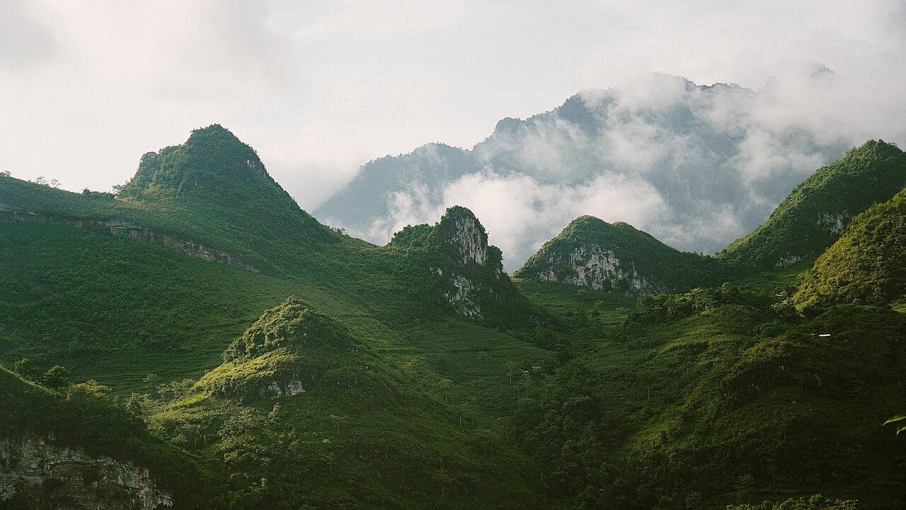Quiet mountain valley village and clear freshwater stream in Du Gia Ha Giang
