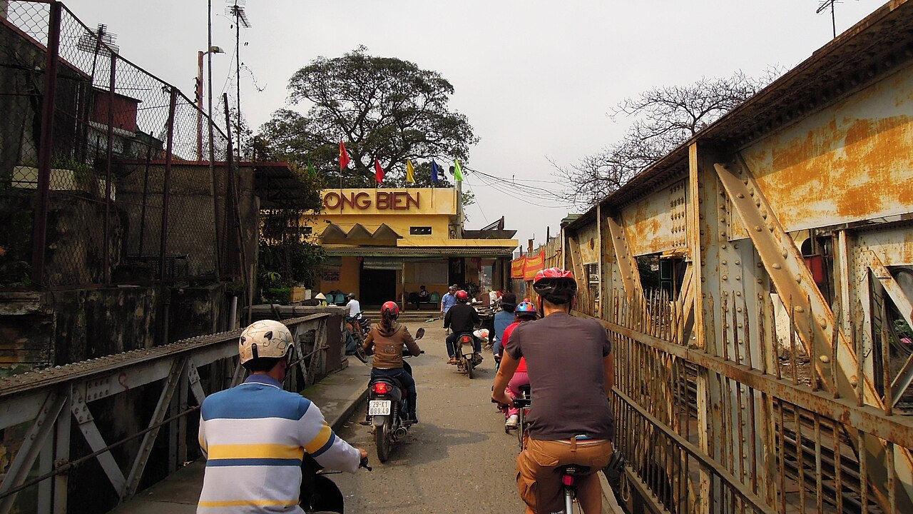 Historic Long Bien Bridge and urban streetscape in Hanoi, Vietnam