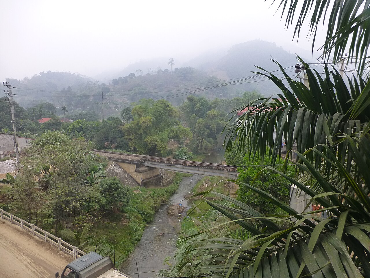 Lao Cai railway station tracks and passenger trains serving the Hanoi-Sapa corridor in northern Vietnam